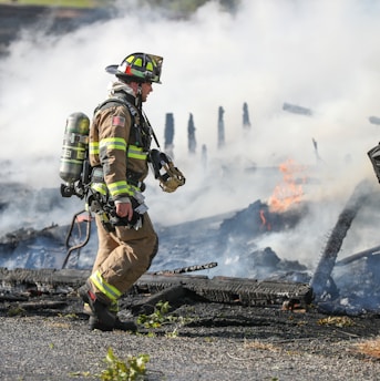 firefighter watching of burning plank