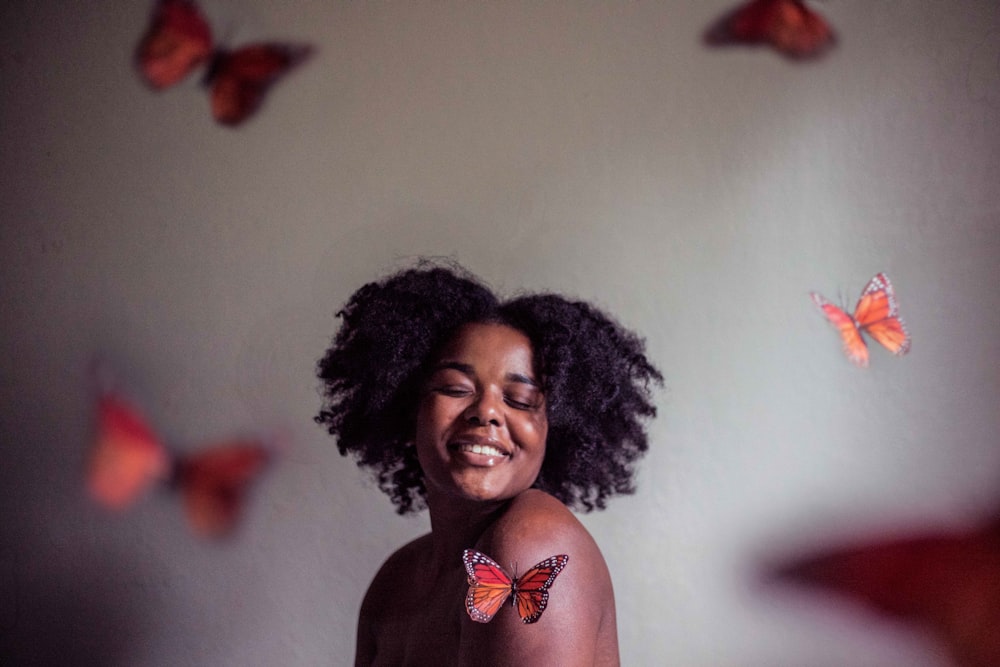 woman surrounded by butterflies