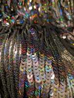 Sequin attachment in action, adding sparkle to textile with flawless speed and accuracy.