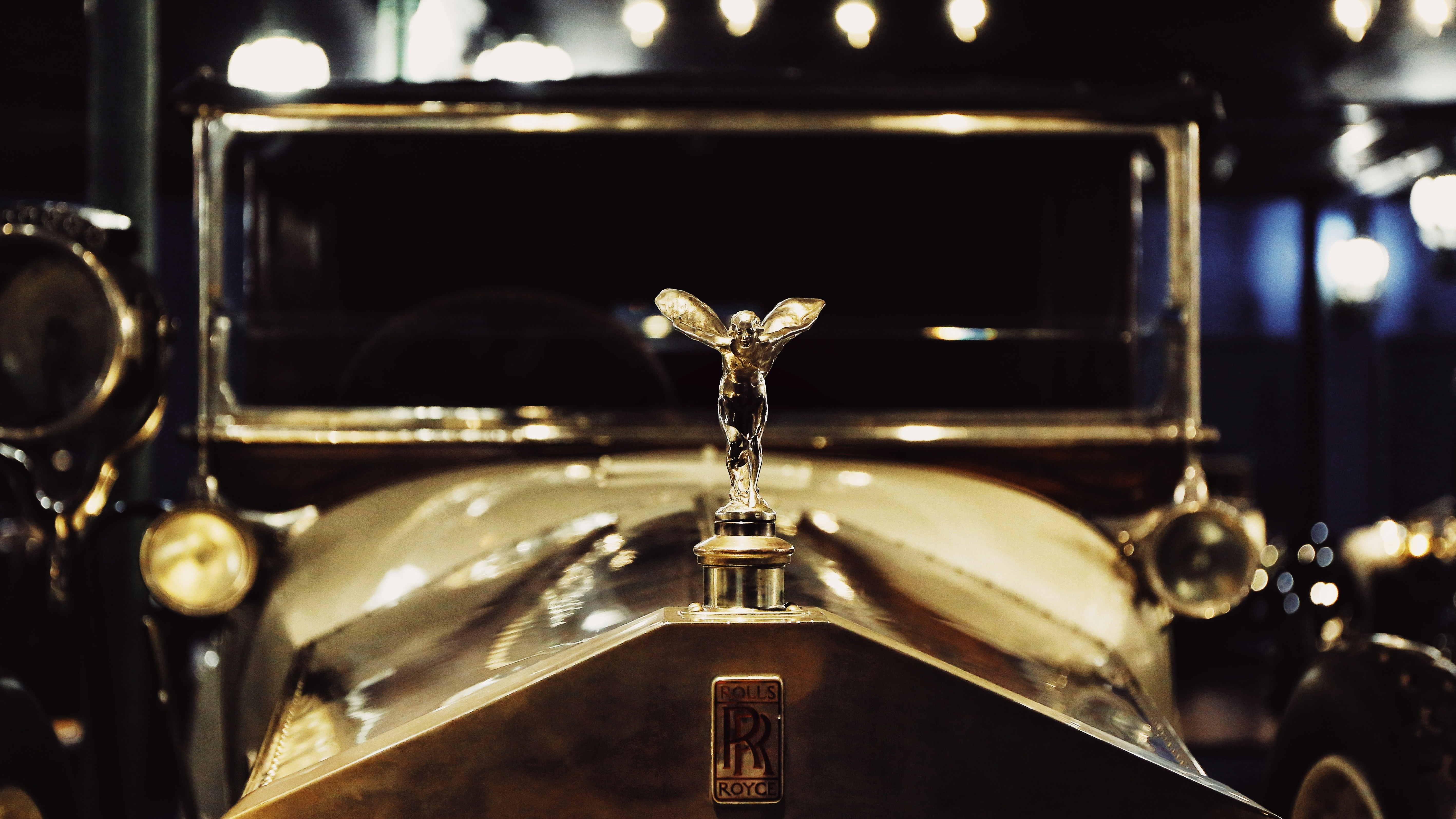 a close up of an old fashioned car on display