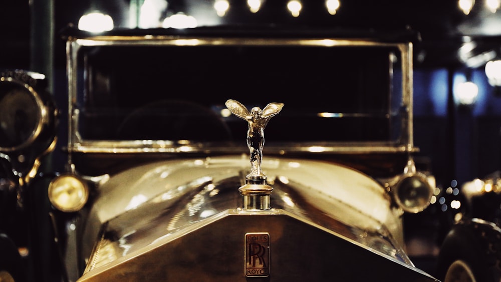 a close up of an old fashioned car on display