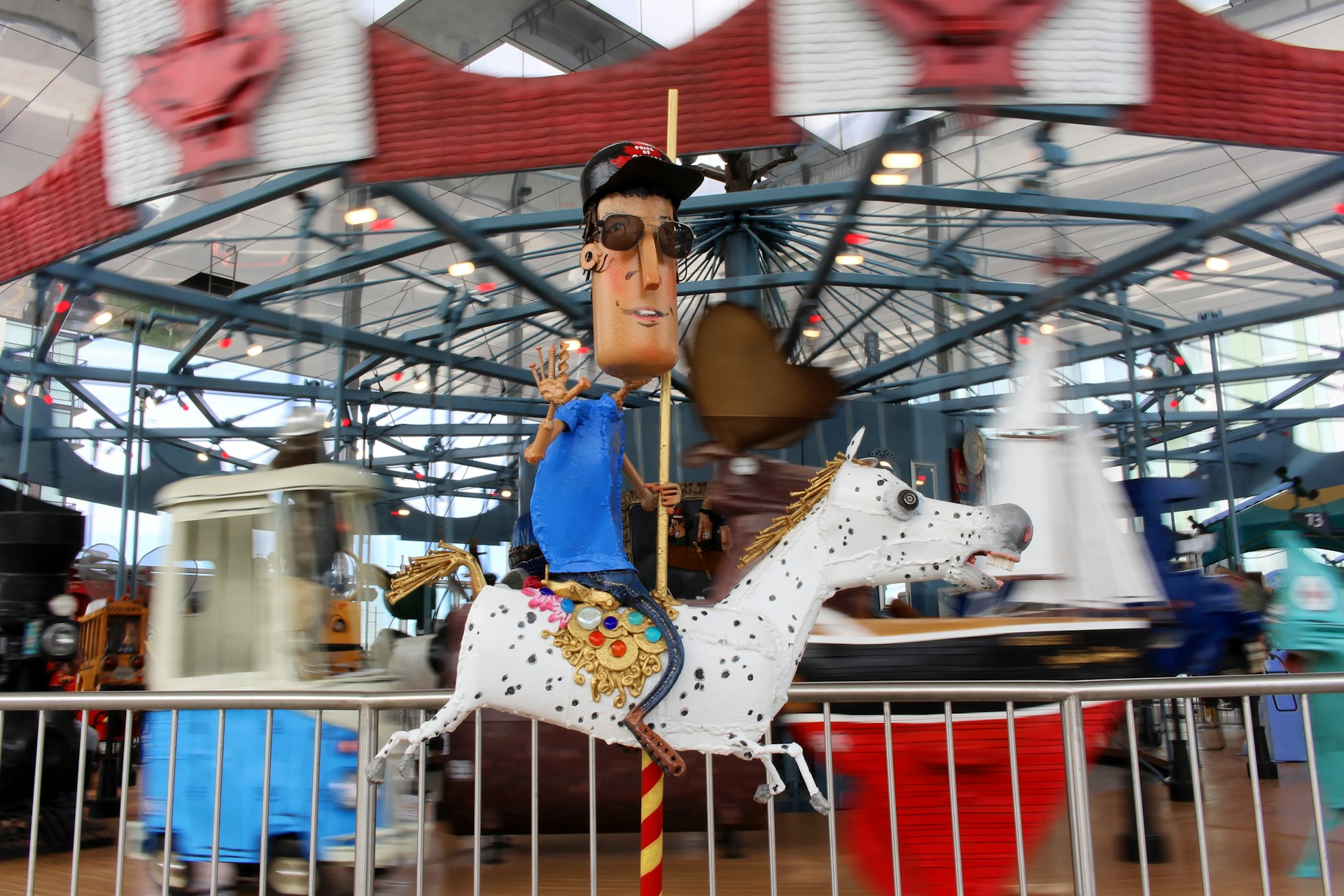 A lively carousel graphic displaying an artistic blend of abstract forms and bright, inviting colors.