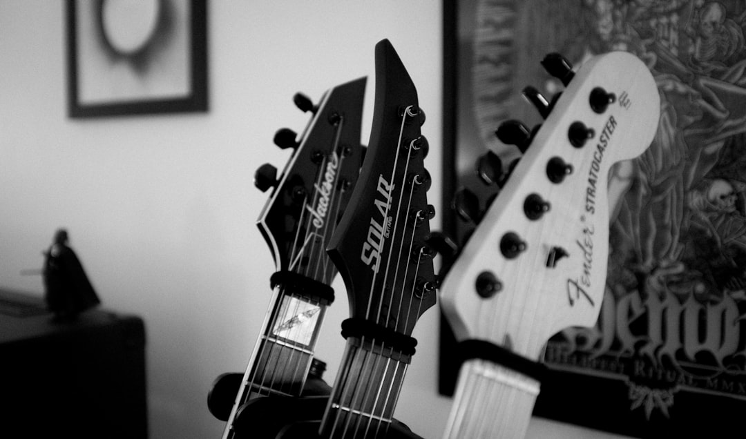 greyscale photography of guitar