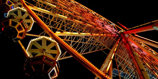 Ferris wheel showing orange lights in Karlsruhe Germany