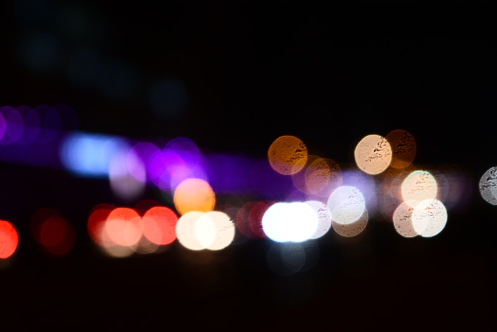 a blurry photo of a city street at night