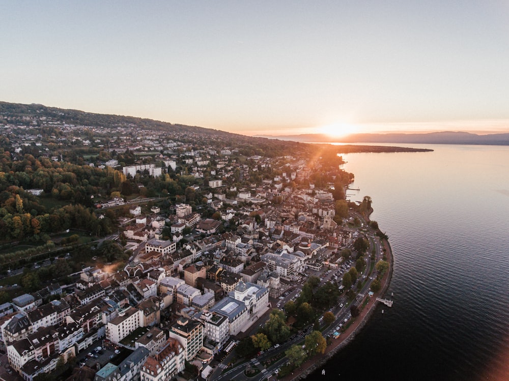 aerial photography of buildings beside sea