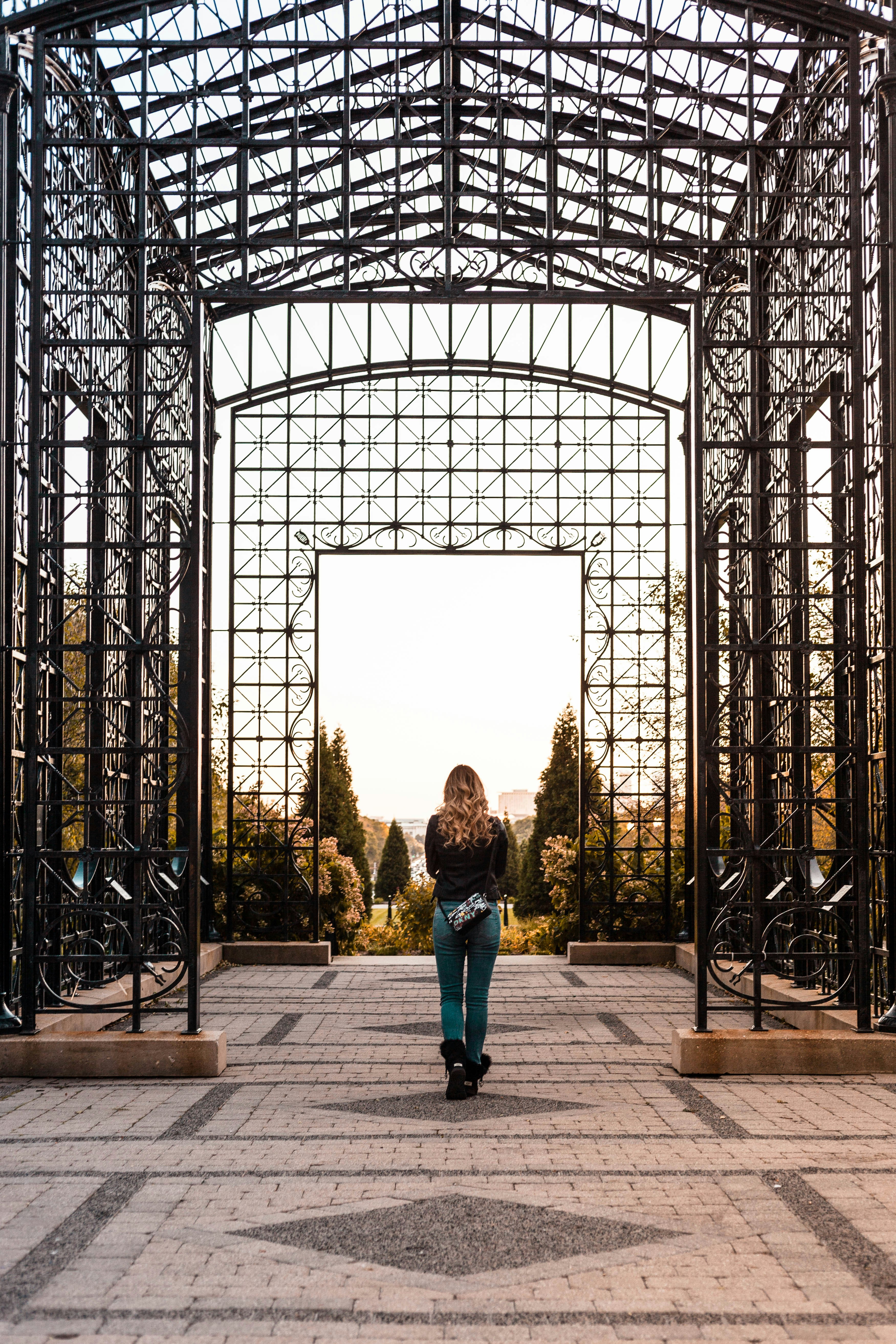 Woman standing inside black canopy frame