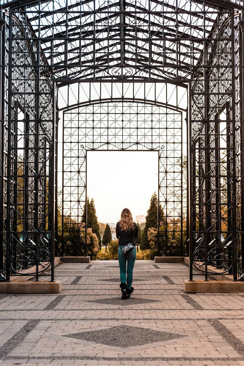 woman standing inside black canopy frame