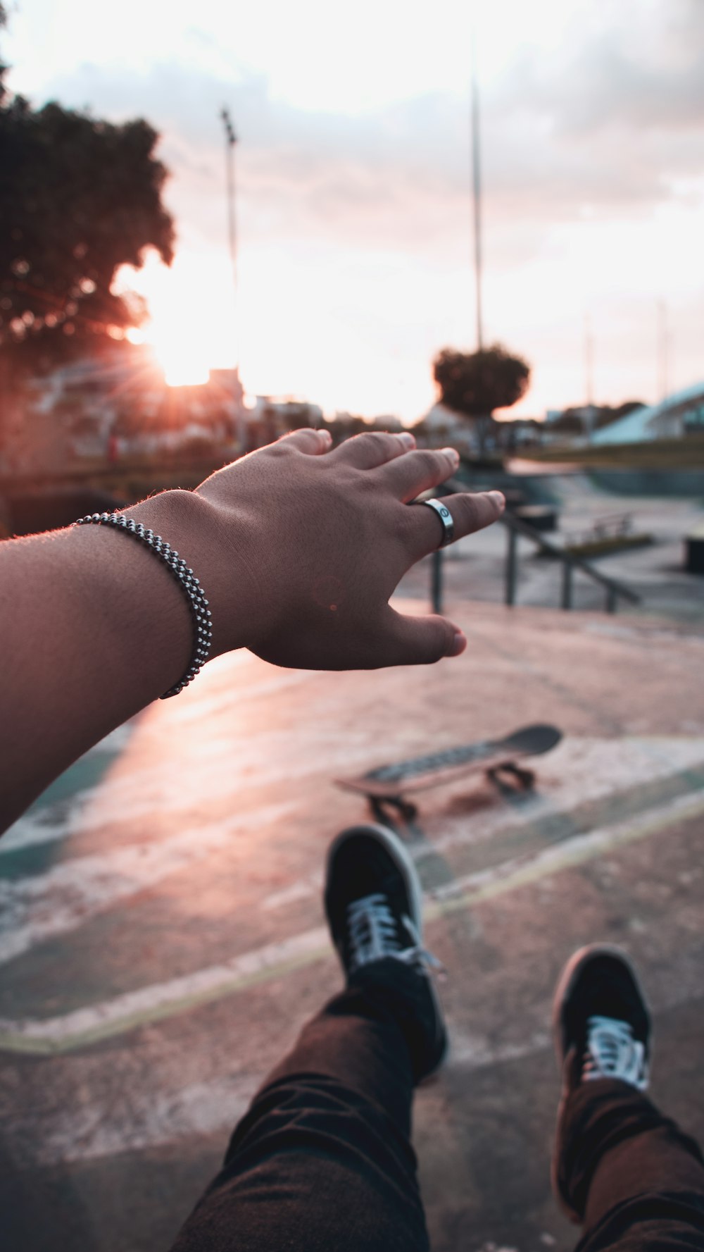 selective focus photography of person near skateboard