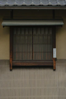 Close-up of sleek TSK 208 Japanese folding window installed in a modern interior.