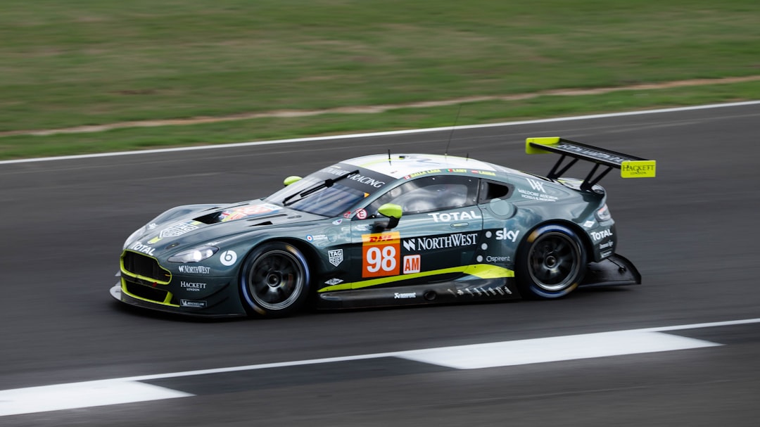 Green Aston Martin world endurance championship racing car on the track - Castle Combe Race Circuit, North Wiltshire, UK – Photo by Jon Hersom | Castle Combe England