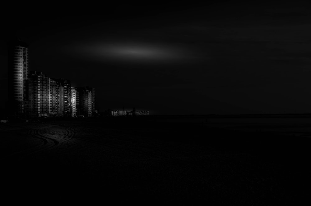 a black and white photo of a city at night