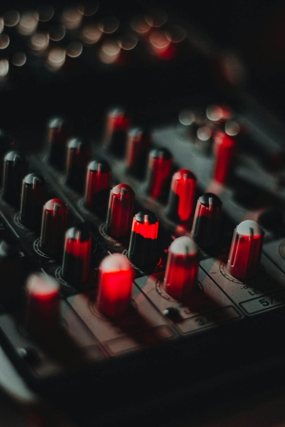 red and black audio mixer knobs