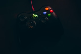 A vibrant game controller glowing with colorful lights, symbolizing the start of an exciting gaming adventure.