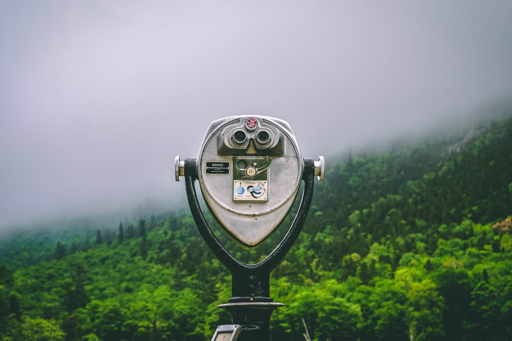 grey and black coin operated sight seeing binocular