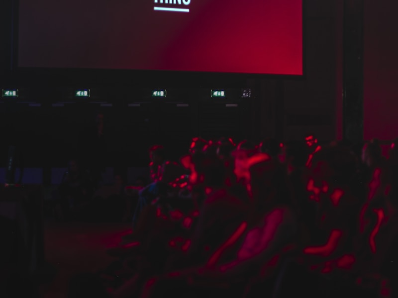 Large crowd at a live event with stage lighting