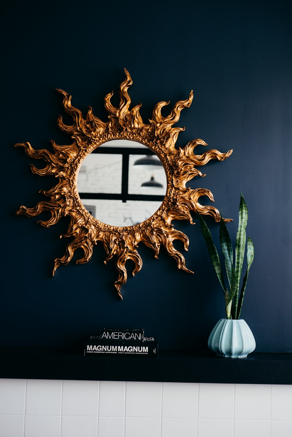 gold sun burst mirror