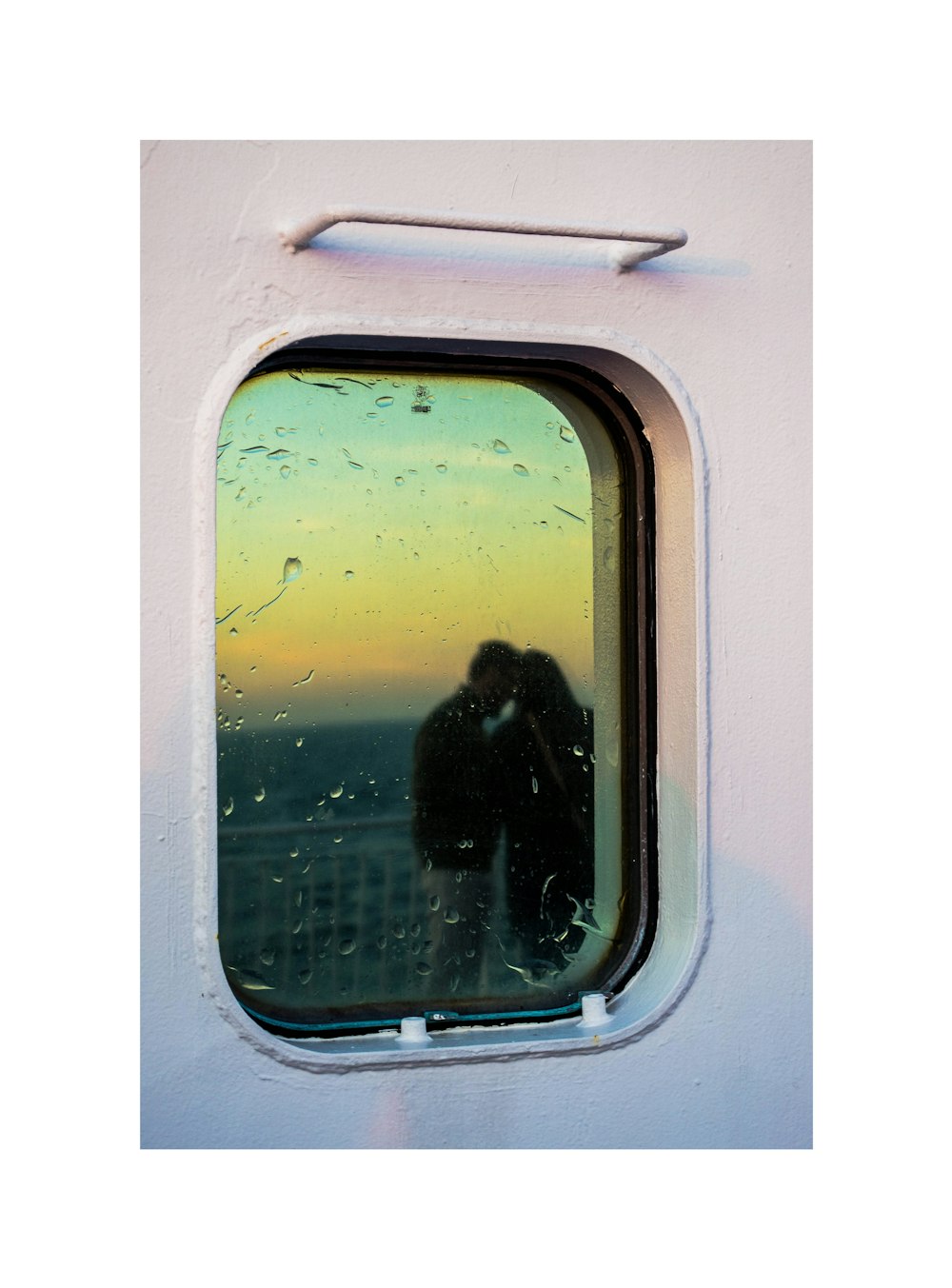 glass window with water dew and reflection