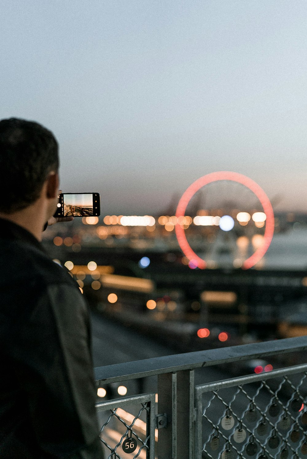 man taking picture using smartphone