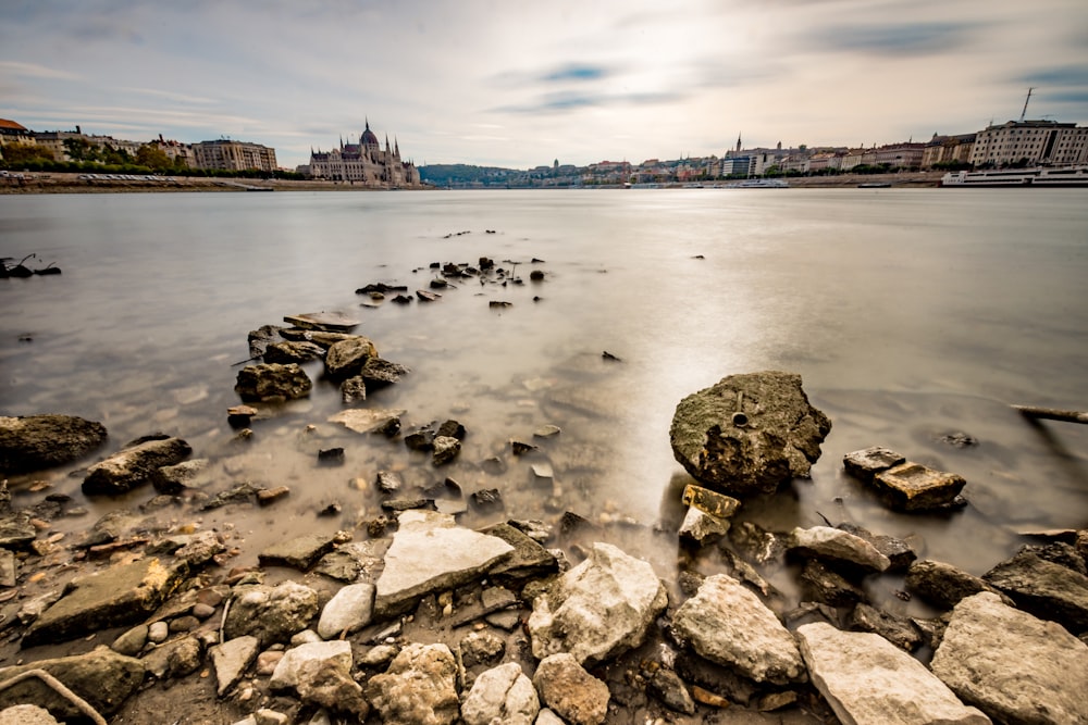 stack of rocks near body of water