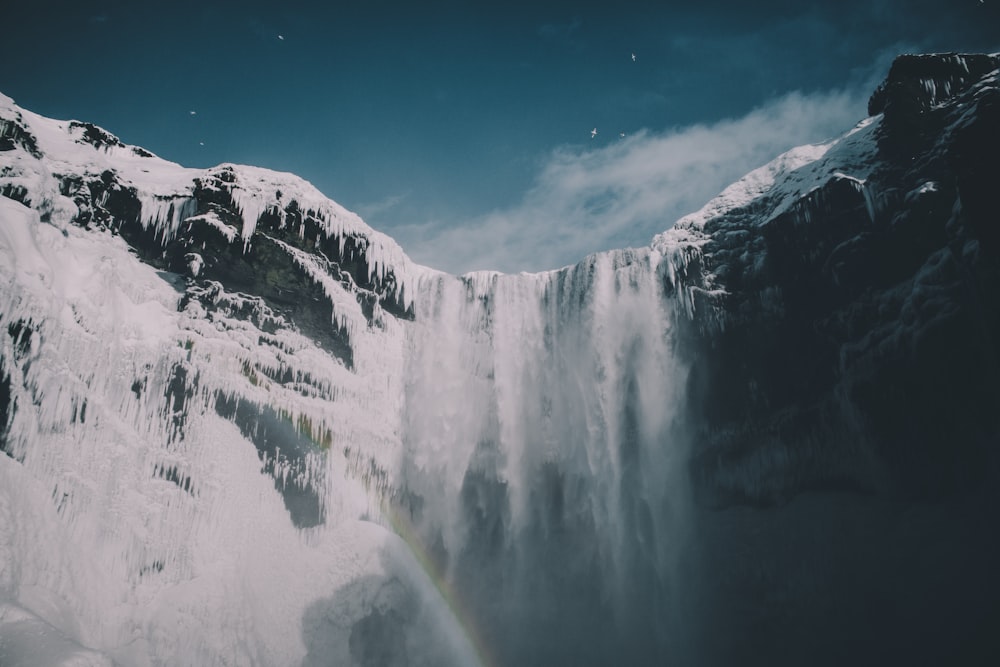 waterfalls under blue sky