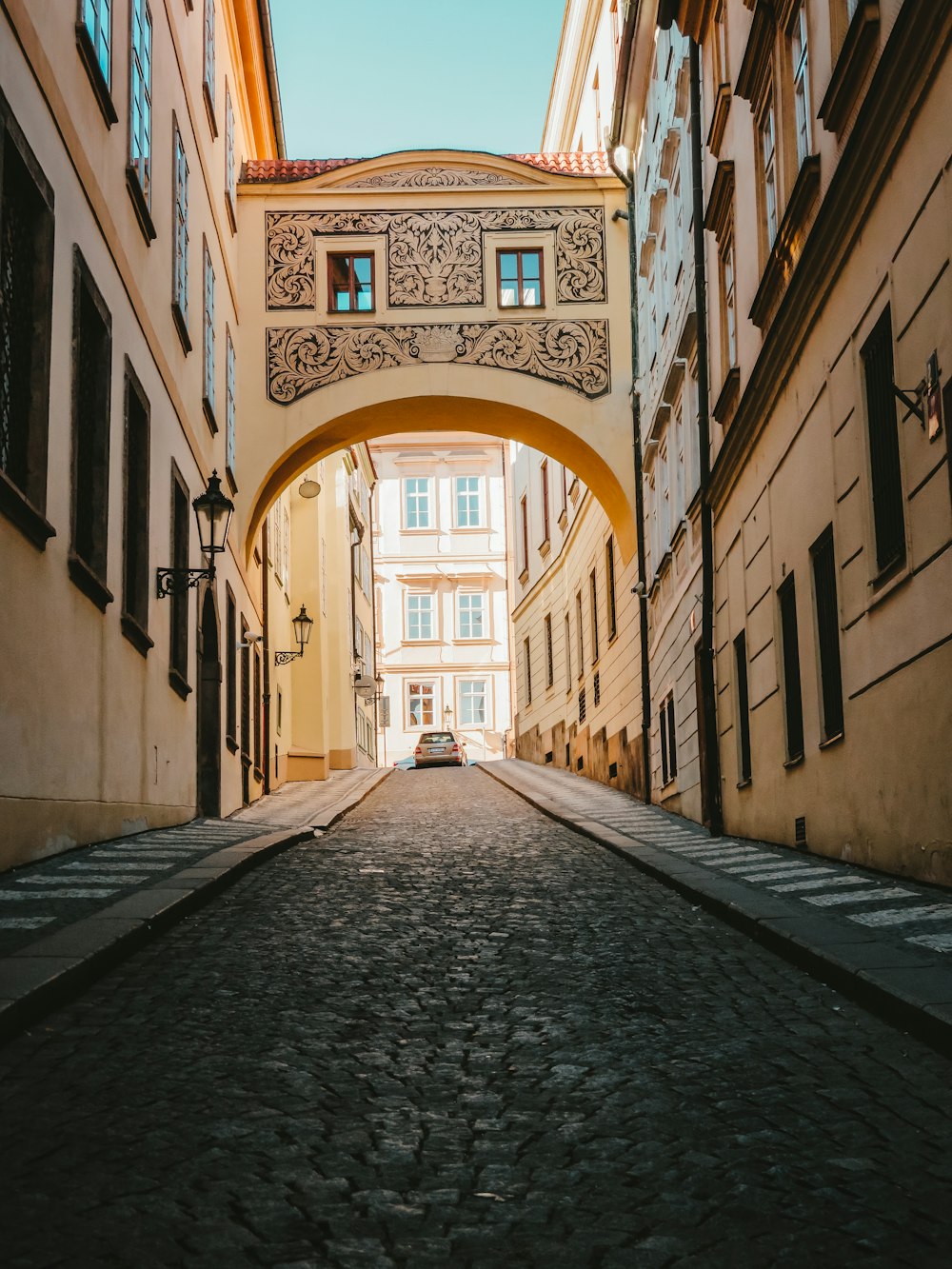 brown archway over stone road