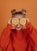 woman in red knit sweater holding lemon