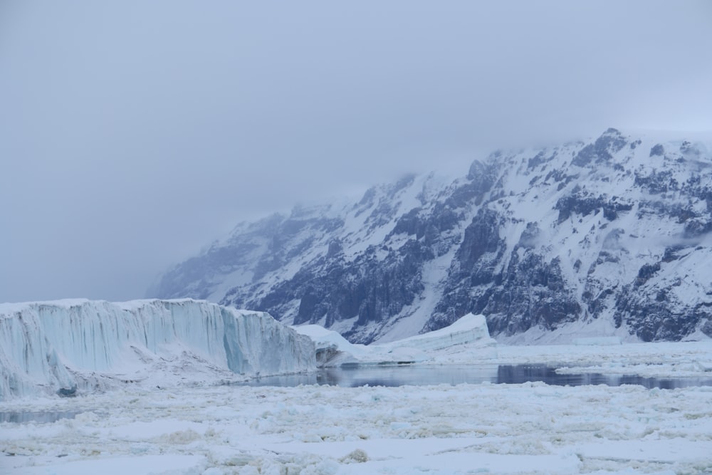 snow covered body of water and mountain