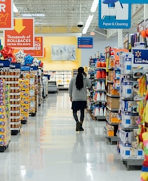 person standing between shelvings