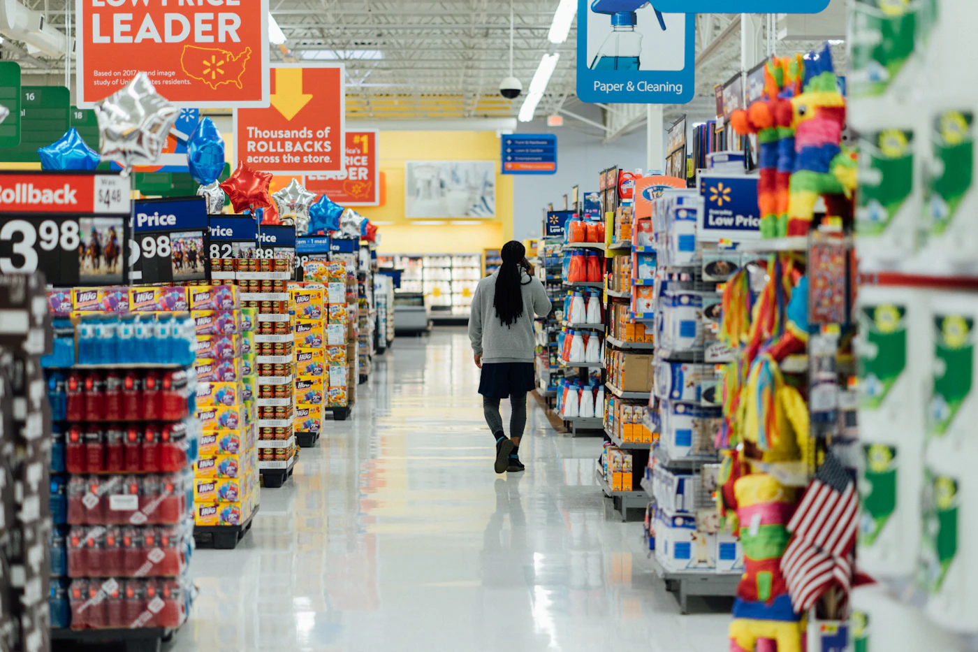 A person standing between two store aisles