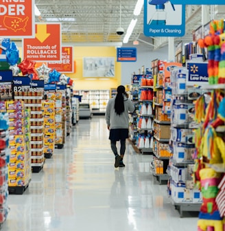 person standing between shelvings