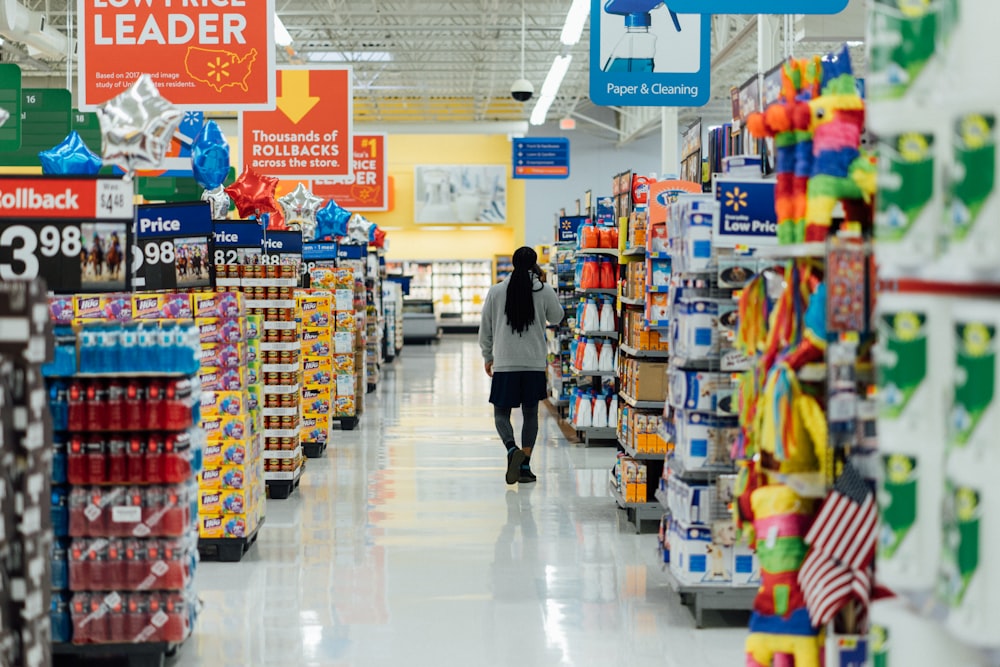 person standing between shelvings