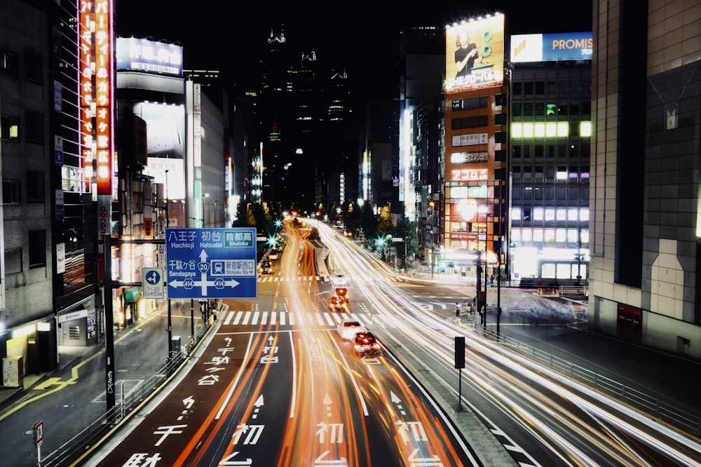 time lapse photography of road beside building