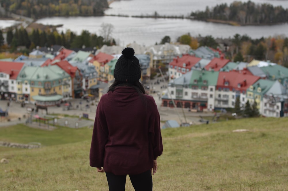 woman standing in front of houses