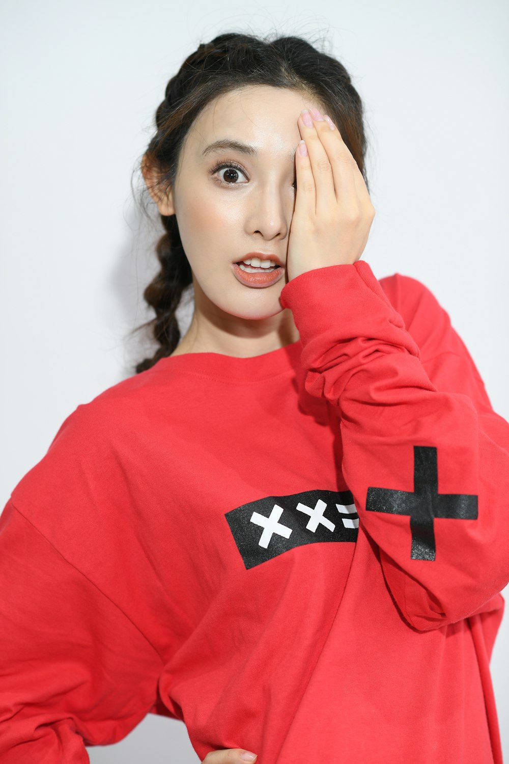 woman wearing red and black sweatshirt