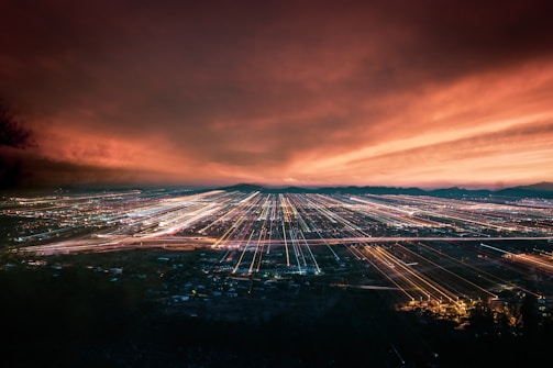 A city skyline at dusk showcasing long exposure light trails.