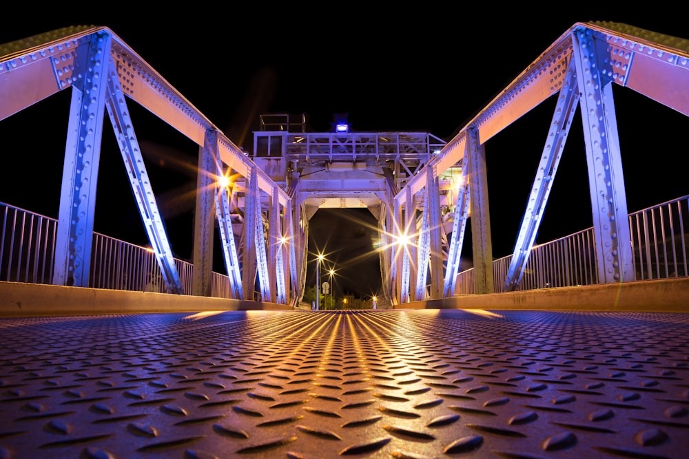 a bridge that is lit up at night