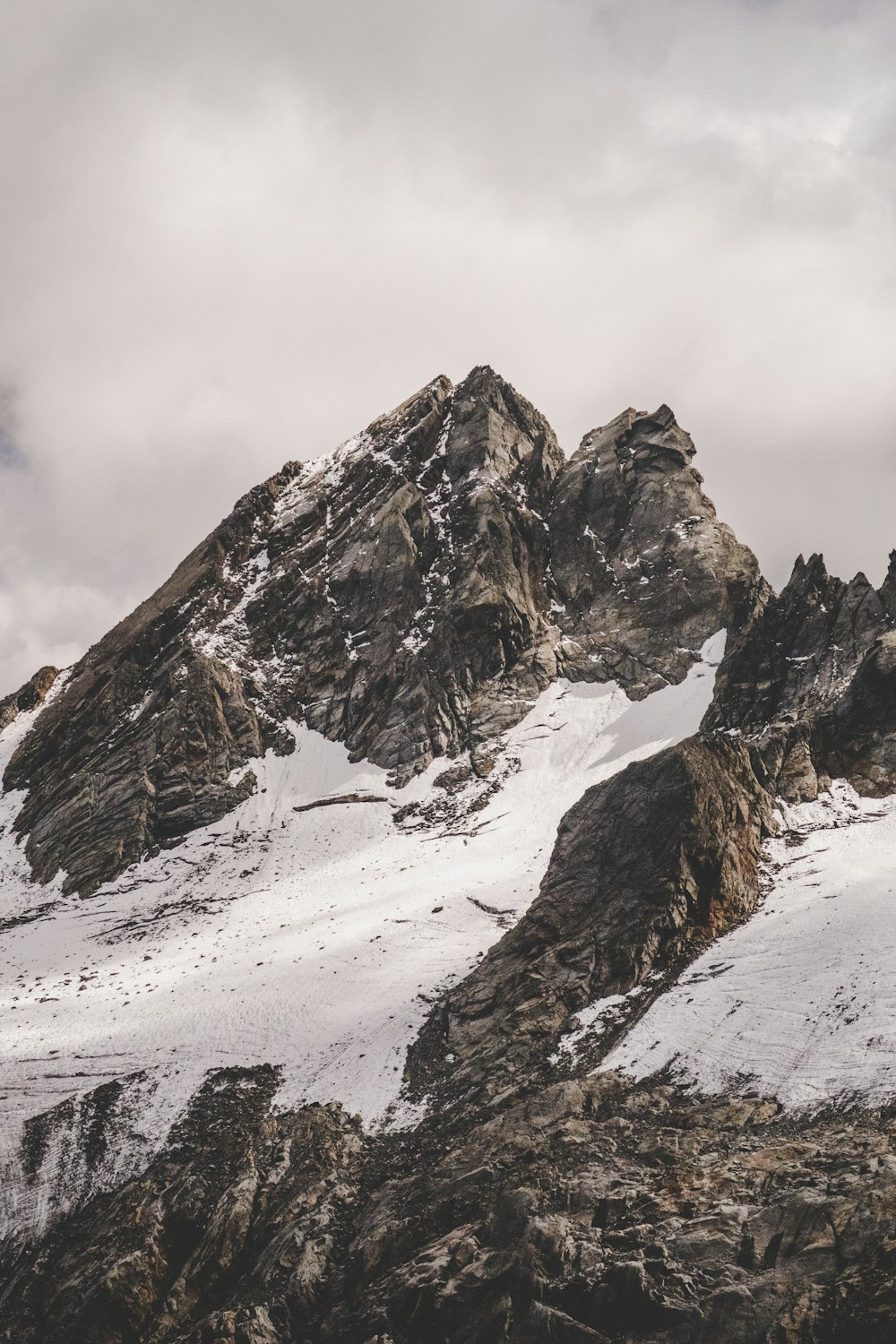 low-angle photography of snow covered mountain during daytime