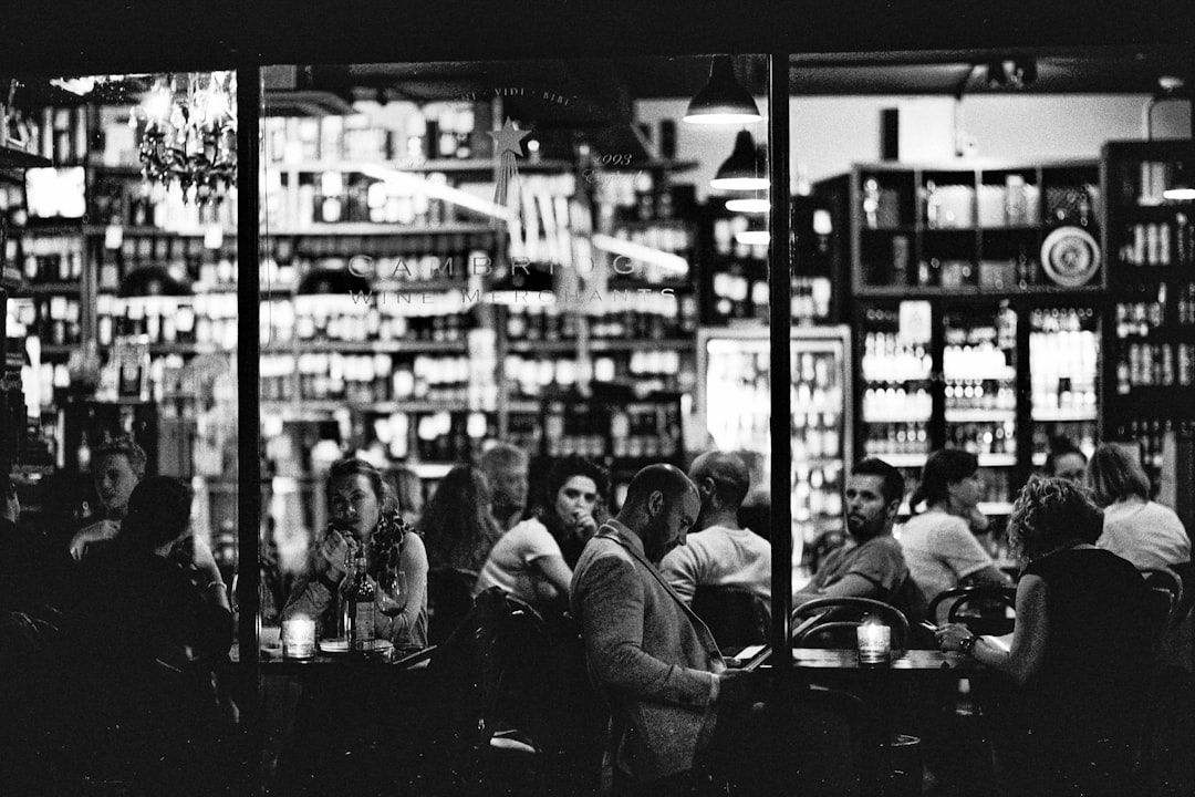 grayscale photography of people outside store