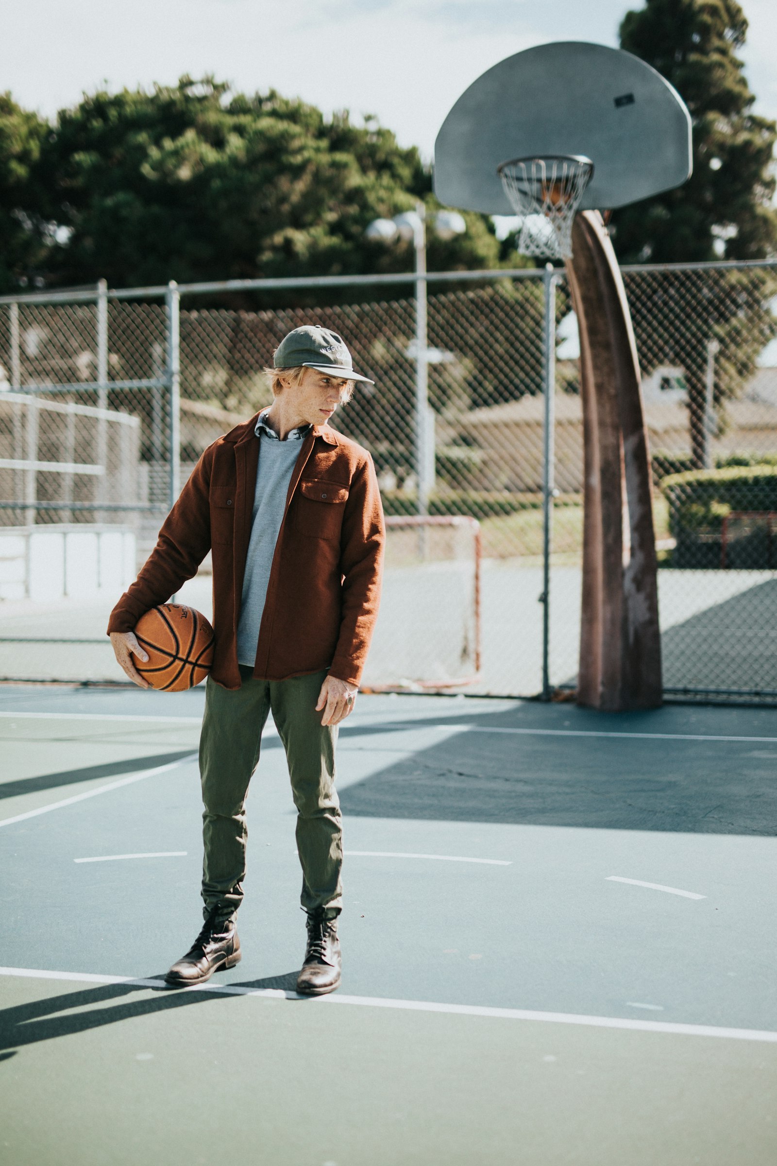 Sigma 50mm F1.4 EX DG HSM sample photo. Man holding basketball photography