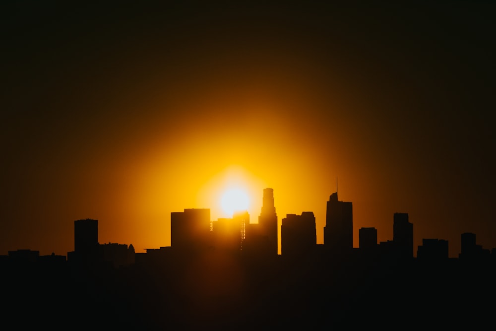 silhouette of a buildings during sunset