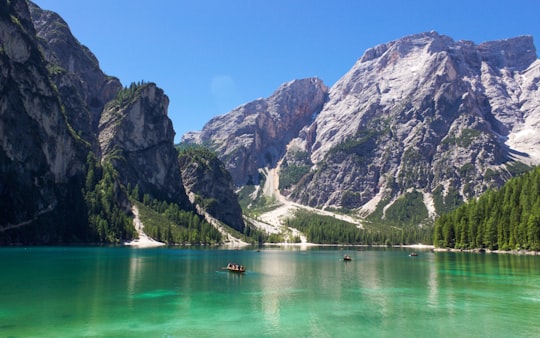 wide angle photo of boat on body of water in Parco naturale di Fanes-Sennes-Braies Italy