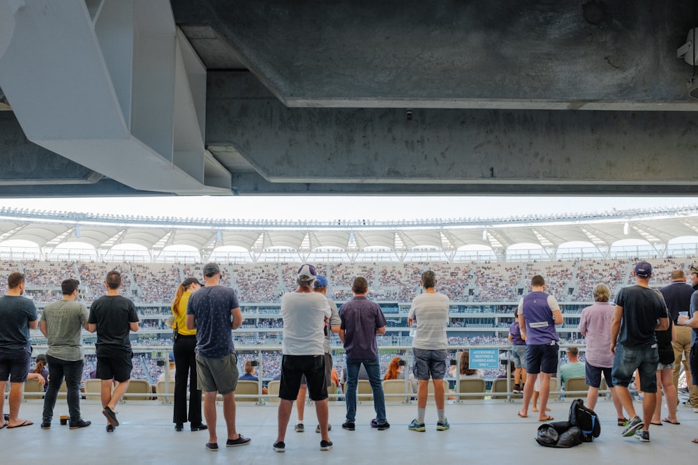 people standing on stadium