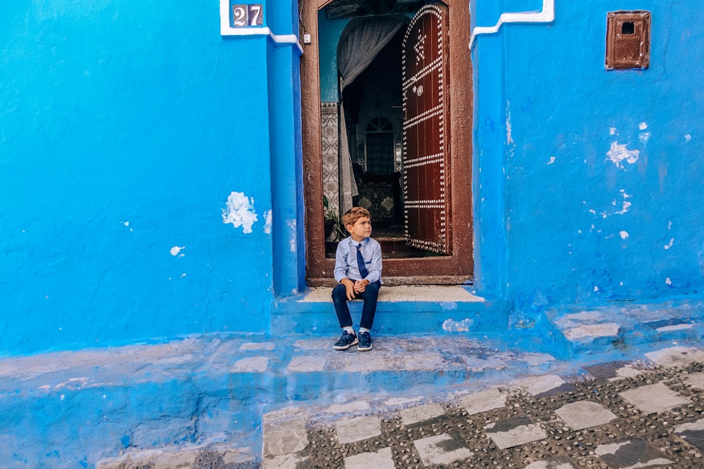 boy sitting on floor