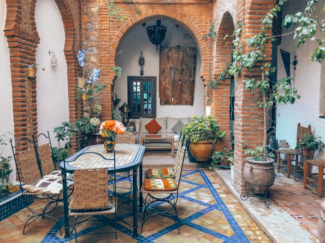 brown wooden table with chairs, Riad in the Rough