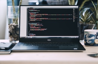 a laptop computer sitting on top of a desk