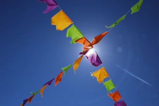 Bright summer-themed banner with colorful sun and shopping bags