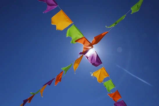 Bright summer-themed banner with colorful sun and shopping bags