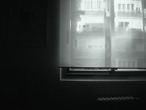 Quiet street view from the window of the minimalist double room.