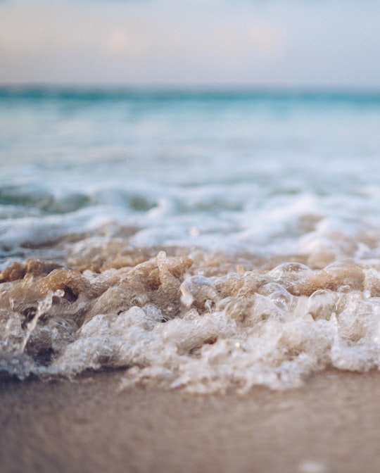 sea wave rolling into beach in Riviera Maya Mexico